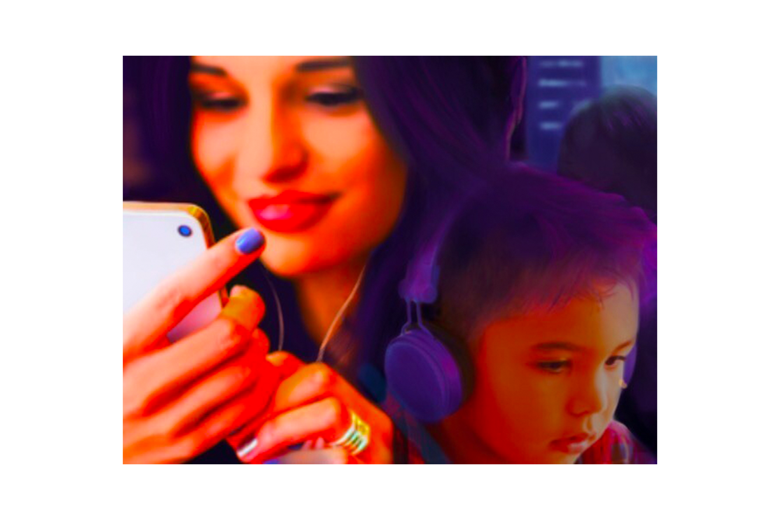 Spray paint mural of woman looking at phone and child watching a laptop